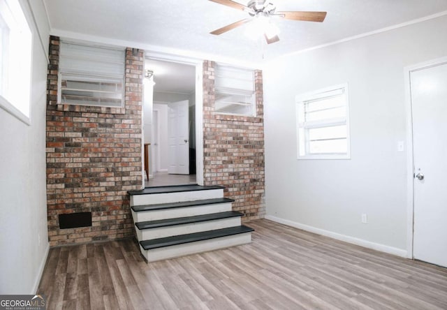 435 Goss Rd, Epworth, GA 30541 - unfurnished living room with wood finished floors, baseboards, a ceiling fan, and stairs