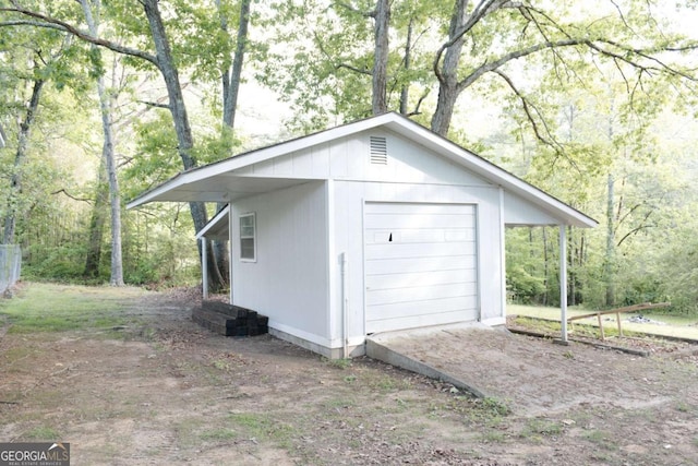 435 Goss Rd, Epworth, GA 30541 - detached garage featuring a view of trees and dirt driveway