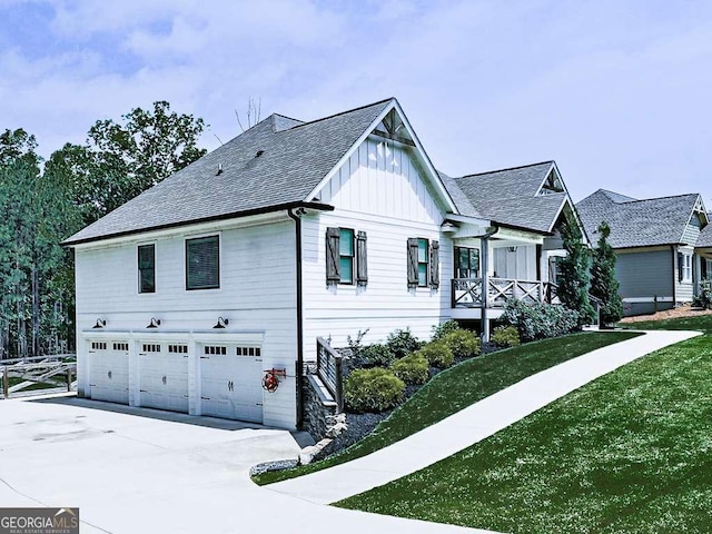 971 Cable Rd, Waleska, GA 30183 - view of home's exterior with board and batten siding, an attached garage, driveway, and a shingled roof