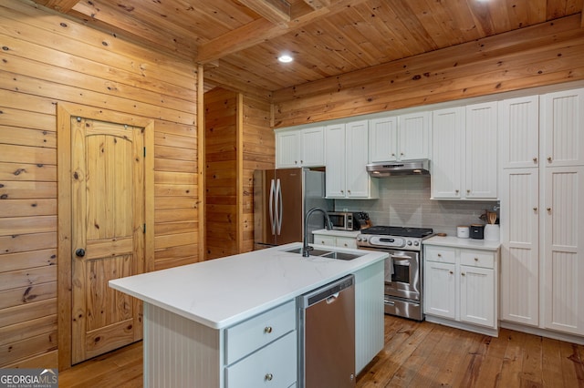4317 Harold Whelchel Rd, Gainesville, GA 30506 - kitchen with appliances with stainless steel finishes, a sink, wooden ceiling with exposed beams, under cabinet range hood, and light wood-type flooring