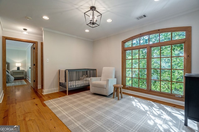4317 Harold Whelchel Rd, Gainesville, GA 30506 - bedroom with crown molding, light wood-style flooring, recessed lighting, baseboards, and a chandelier