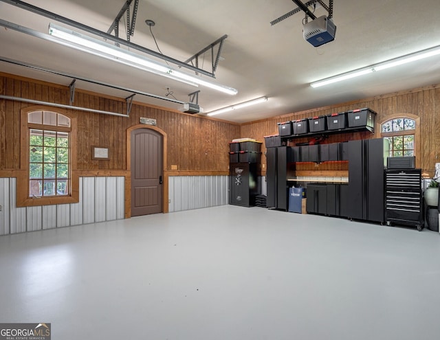 4317 Harold Whelchel Rd, Gainesville, GA 30506 - garage with a garage door opener and wood walls