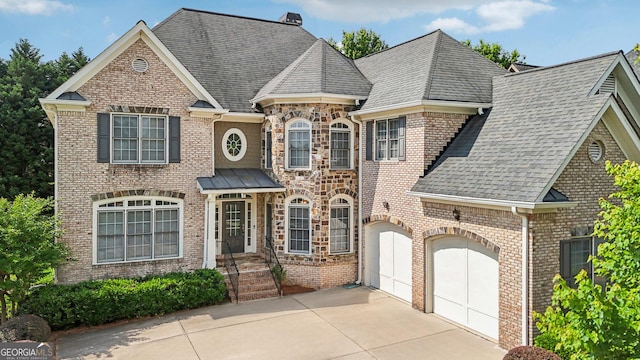 2871 Trailing Ivy Way, Buford, GA 30519 - view of front facade with concrete driveway, a shingled roof, brick siding, and a chimney