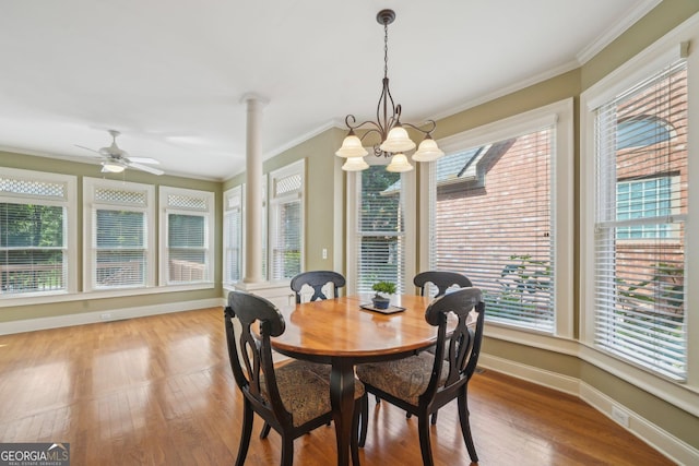 2871 Trailing Ivy Way, Buford, GA 30519 - dining room with plenty of natural light, wood finished floors, ornamental molding, and ornate columns