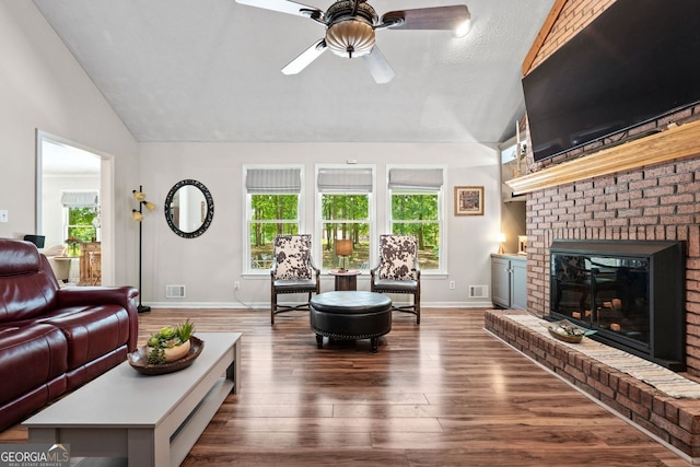 401 Riverwalk, Mcdonough, GA 30252 - living room with a ceiling fan, hardwood / wood-style floors, baseboards, a brick fireplace, and high vaulted ceiling