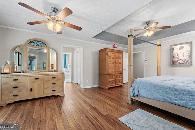 401 Riverwalk, Mcdonough, GA 30252 - bedroom with dark wood-style flooring, baseboards, crown molding, a ceiling fan, and ensuite bathroom