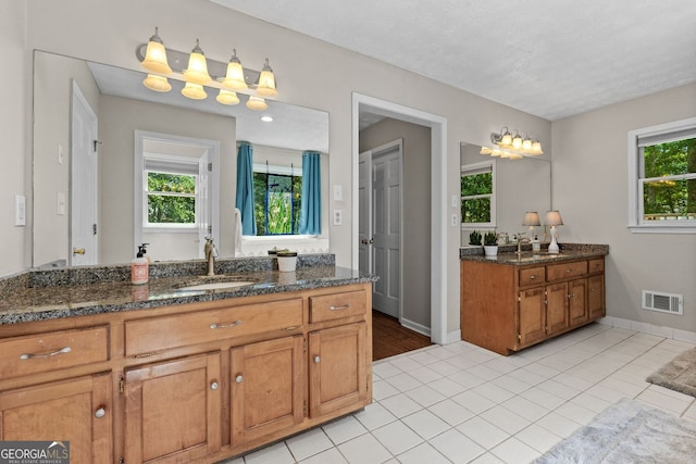 401 Riverwalk, Mcdonough, GA 30252 - bathroom featuring vanity, tile patterned flooring, and baseboards