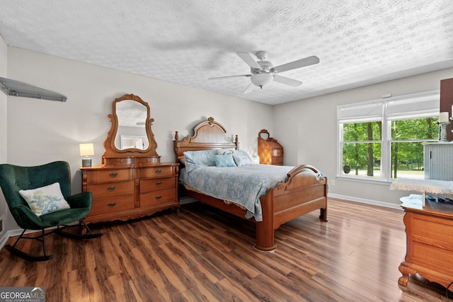 401 Riverwalk, Mcdonough, GA 30252 - bedroom featuring wood finished floors, a textured ceiling, baseboards, and a ceiling fan