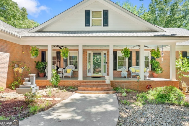 401 Riverwalk, Mcdonough, GA 30252 - property entrance with covered porch, brick siding, ceiling fan, and a shingled roof