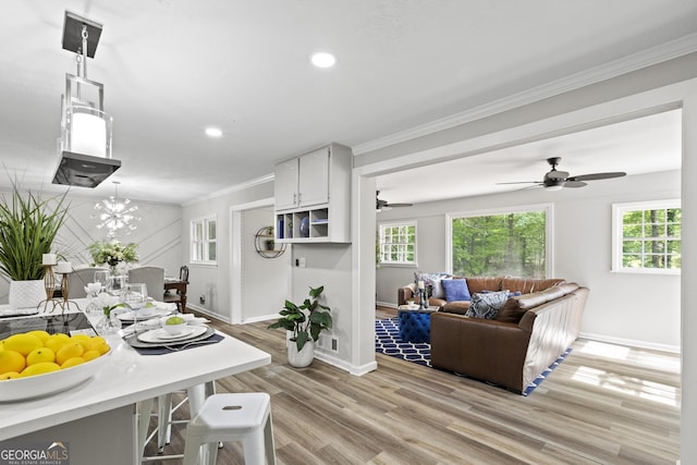 1143 Mcgarity Rd, Mcdonough, GA 30252 - kitchen with baseboards, crown molding, light wood-style floors, light countertops, and recessed lighting