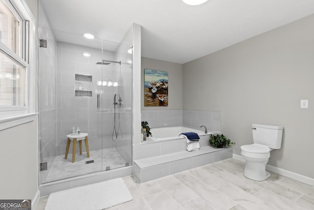 1143 Mcgarity Rd, Mcdonough, GA 30252 - full bath featuring a garden tub, toilet, a stall shower, baseboards, and marble finish floors