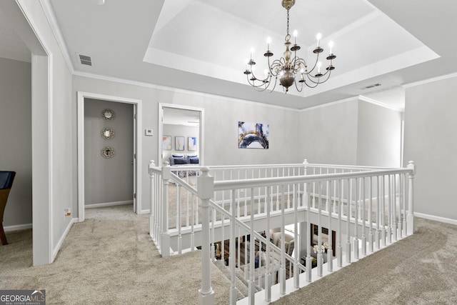 1143 Mcgarity Rd, Mcdonough, GA 30252 - stairs with carpet flooring, a tray ceiling, a chandelier, and ornamental molding