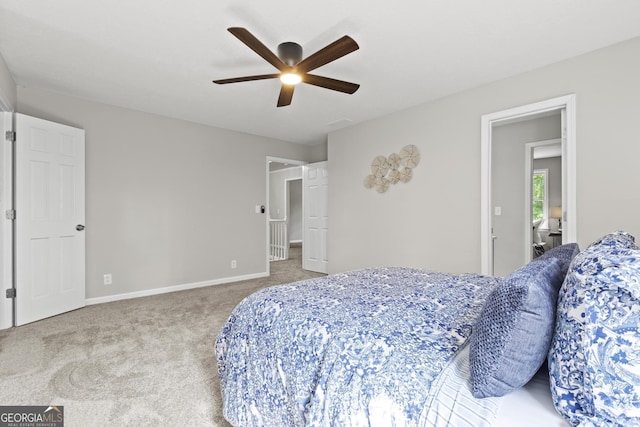 1143 Mcgarity Rd, Mcdonough, GA 30252 - carpeted bedroom with baseboards and a ceiling fan