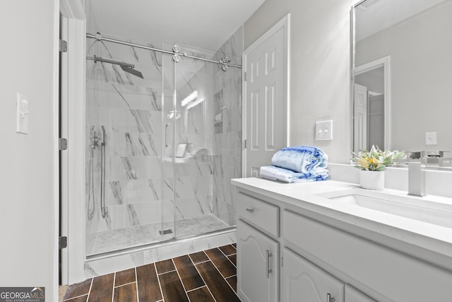 1143 Mcgarity Rd, Mcdonough, GA 30252 - bathroom featuring vanity, a marble finish shower, and wood finished floors