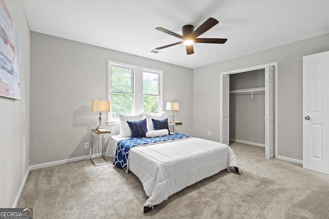 1143 Mcgarity Rd, Mcdonough, GA 30252 - bedroom with carpet flooring, a closet, baseboards, and a ceiling fan