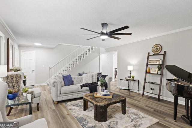 1143 Mcgarity Rd, Mcdonough, GA 30252 - living area featuring stairway, a ceiling fan, crown molding, baseboards, and wood finished floors