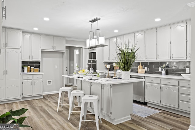1143 Mcgarity Rd, Mcdonough, GA 30252 - kitchen featuring stainless steel dishwasher, tasteful backsplash, light countertops, recessed lighting, and oven