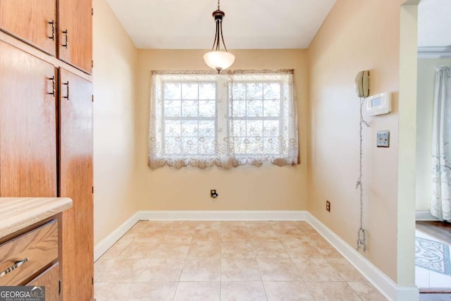 2211 Jonathan Ave, Lithonia, GA 30058 - unfurnished dining area featuring baseboards and light tile patterned floors