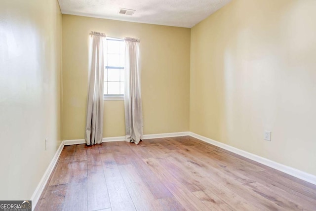 2211 Jonathan Ave, Lithonia, GA 30058 - unfurnished room featuring hardwood / wood-style flooring and baseboards