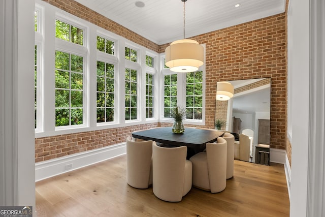 4560 Harris Trl, Atlanta, GA 30327 - sunroom featuring brick wall, wood finished floors, and baseboards