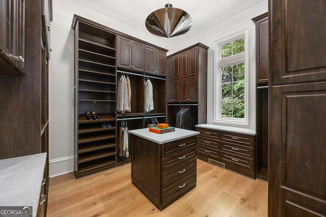 4560 Harris Trl, Atlanta, GA 30327 - walk in closet featuring built in study area and light wood finished floors