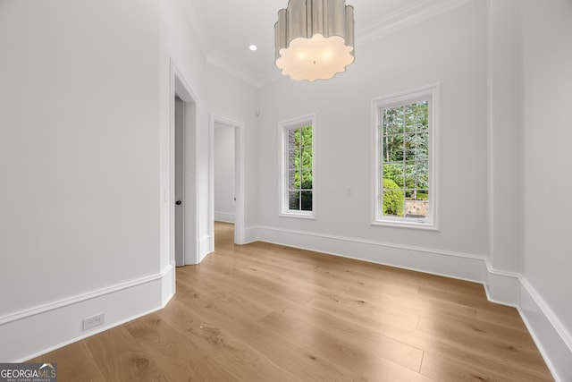 4560 Harris Trl, Atlanta, GA 30327 - spare room with ornamental molding, light wood-type flooring, and baseboards
