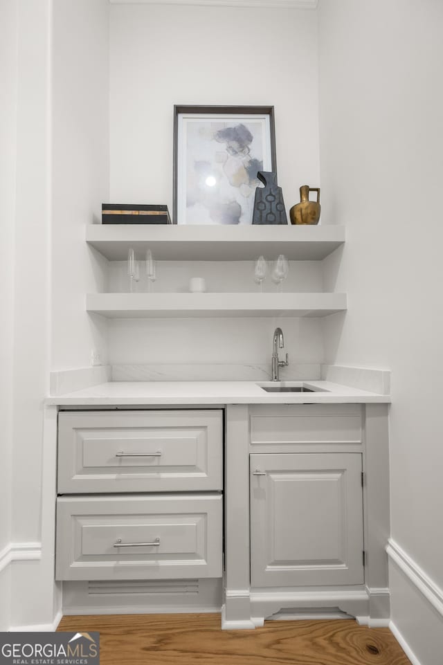 4560 Harris Trl, Atlanta, GA 30327 - indoor wet bar featuring wood finished floors