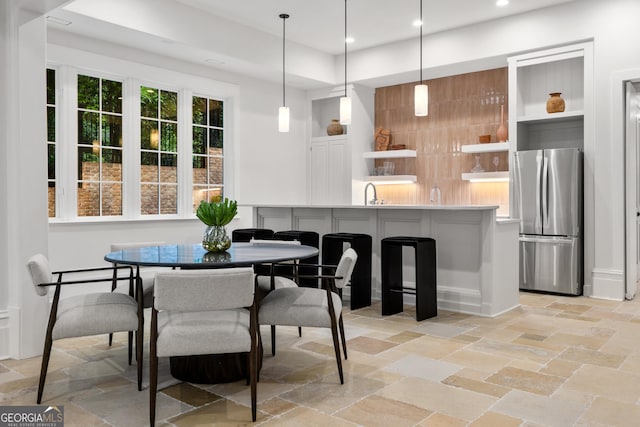 4560 Harris Trl, Atlanta, GA 30327 - dining space with stone tile flooring and recessed lighting