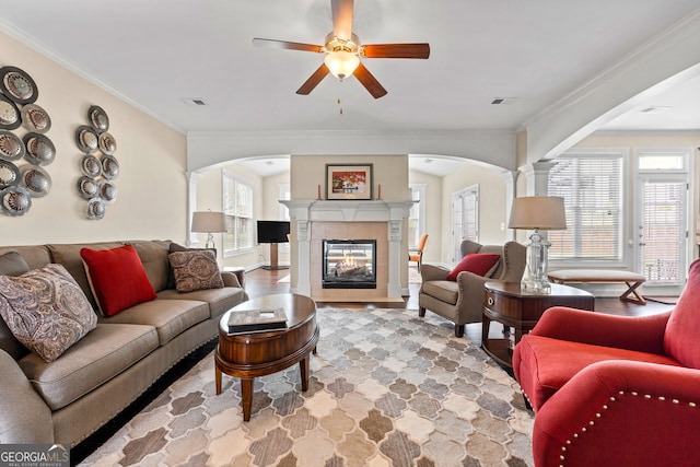 1516 Winward Dr, Locust Grove, GA 30248 - living area featuring arched walkways, healthy amount of natural light, and ornamental molding