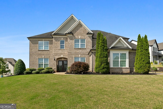 1516 Winward Dr, Locust Grove, GA 30248 - view of front of house featuring brick siding, a front yard, and french doors