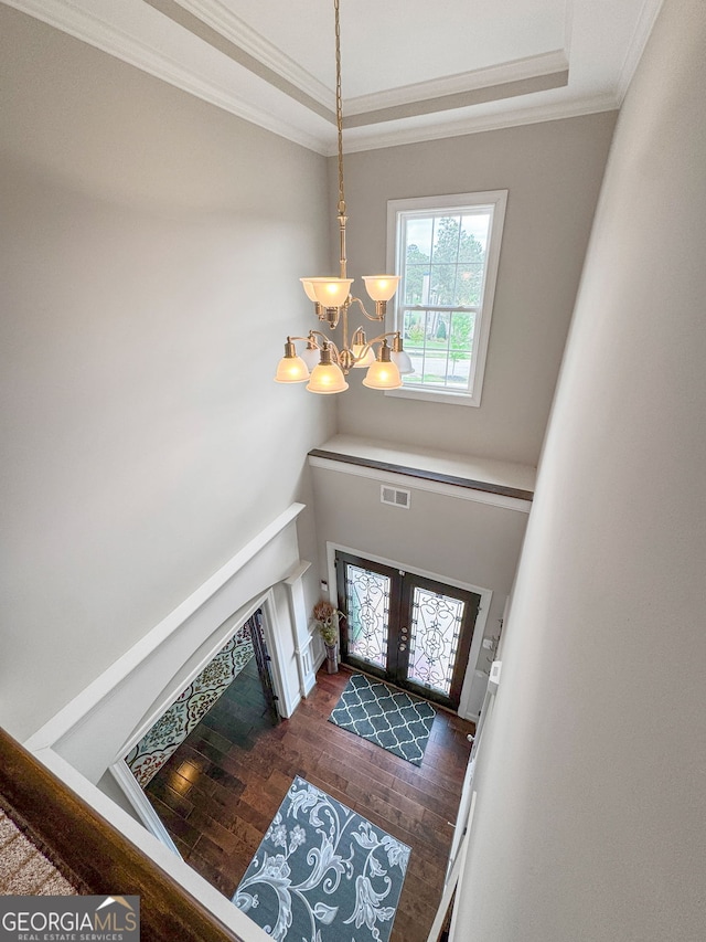 1516 Winward Dr, Locust Grove, GA 30248 - foyer with a chandelier, wood finished floors, crown molding, a raised ceiling, and french doors