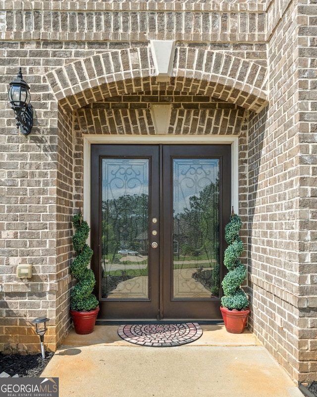 1516 Winward Dr, Locust Grove, GA 30248 - entrance to property with french doors and brick siding