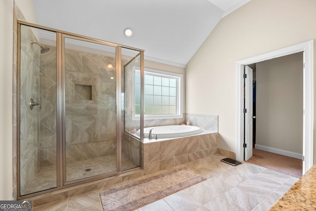 1516 Winward Dr, Locust Grove, GA 30248 - bathroom featuring vaulted ceiling, a garden tub, a stall shower, and baseboards