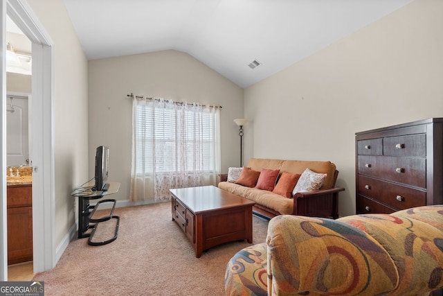 1516 Winward Dr, Locust Grove, GA 30248 - living area with light carpet, lofted ceiling, and baseboards