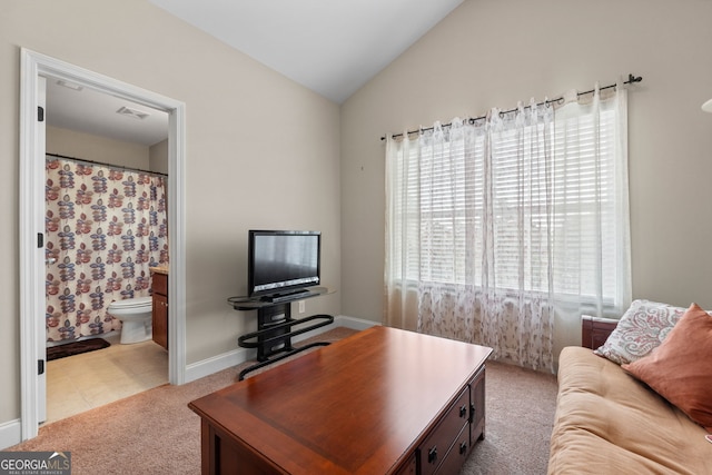 1516 Winward Dr, Locust Grove, GA 30248 - carpeted living area featuring lofted ceiling, baseboards, and a desk