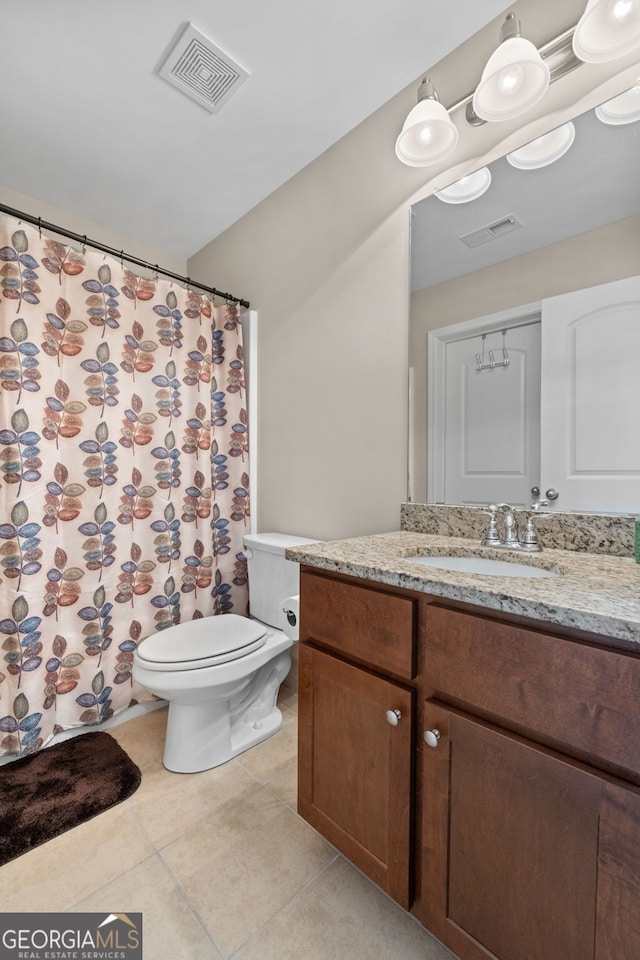 1516 Winward Dr, Locust Grove, GA 30248 - full bath featuring tile patterned floors, vanity, toilet, and curtained shower