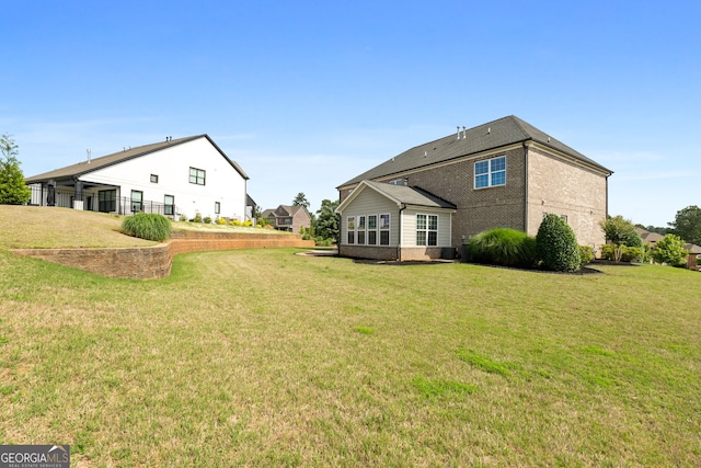 1516 Winward Dr, Locust Grove, GA 30248 - rear view of house with brick siding and a yard