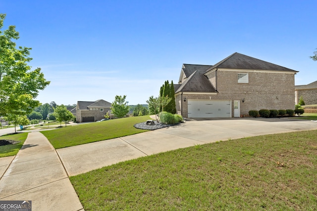 1516 Winward Dr, Locust Grove, GA 30248 - view of property exterior with brick siding, concrete driveway, a garage, and a yard