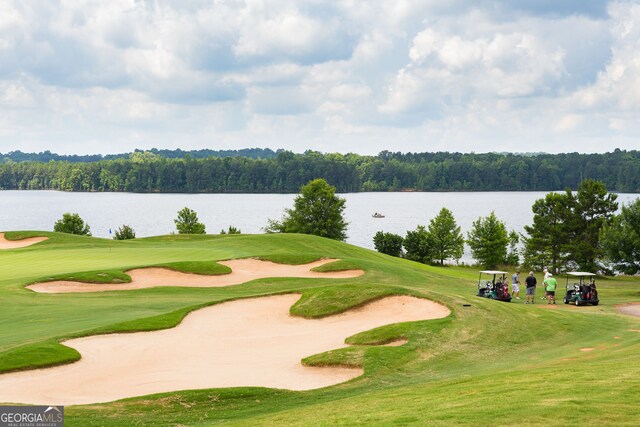 1516 Winward Dr, Locust Grove, GA 30248 - view of community featuring a water view, golf course view, and a view of trees