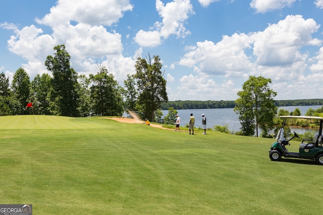 1516 Winward Dr, Locust Grove, GA 30248 - view of community featuring golf course view, a lawn, and a water view
