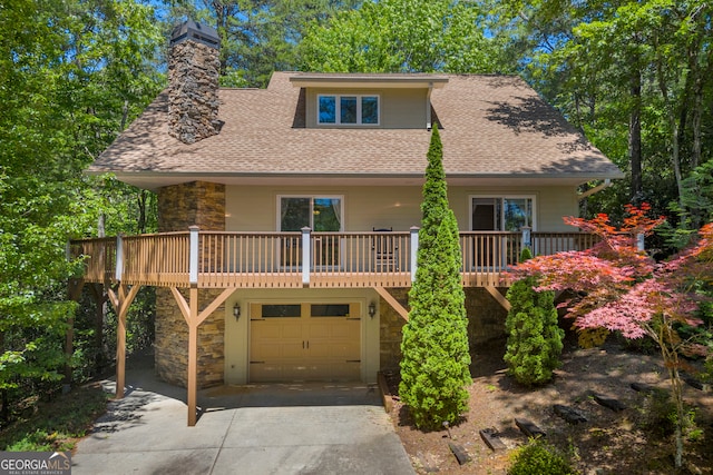 117 Rosen Strasse, Helen, GA 30545 - view of front of home featuring stone siding, a shingled roof, driveway, an attached garage, and a chimney