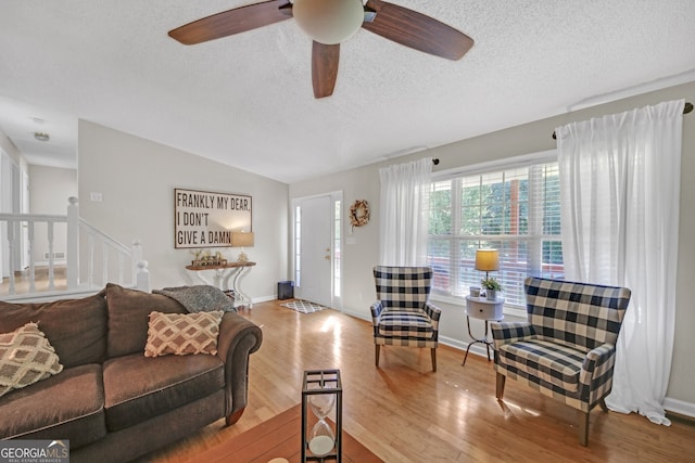 2006 Carrollton Hwy, Temple, GA 30179 - living room with a textured ceiling, wood finished floors, ceiling fan, lofted ceiling, and baseboards