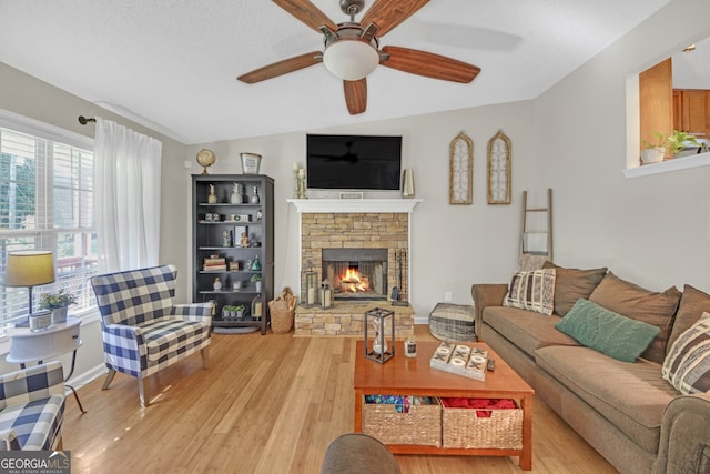 2006 Carrollton Hwy, Temple, GA 30179 - living room with ceiling fan, vaulted ceiling, a fireplace, and light wood finished floors