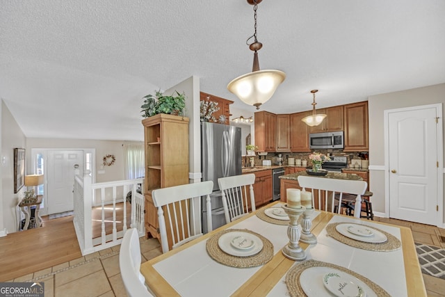 2006 Carrollton Hwy, Temple, GA 30179 - dining room featuring a textured ceiling and light tile patterned flooring