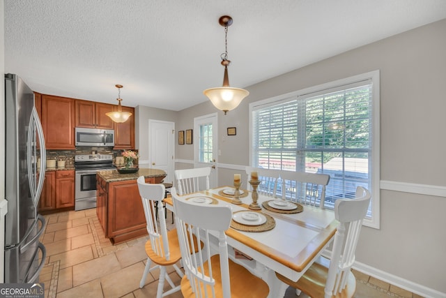 2006 Carrollton Hwy, Temple, GA 30179 - dining area with baseboards and a textured ceiling