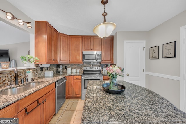 2006 Carrollton Hwy, Temple, GA 30179 - kitchen featuring stainless steel appliances, a sink, decorative backsplash, and dark stone countertops