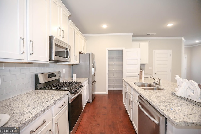 2304 Shetley Creek Dr, Norcross, GA 30071 - kitchen featuring stainless steel appliances, a sink, crown molding, white cabinets, and a center island with sink