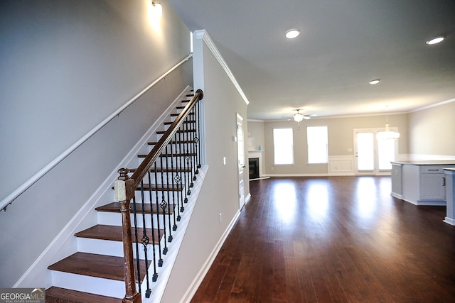 2304 Shetley Creek Dr, Norcross, GA 30071 - stairway featuring ornamental molding, ceiling fan, wood finished floors, a glass covered fireplace, and recessed lighting