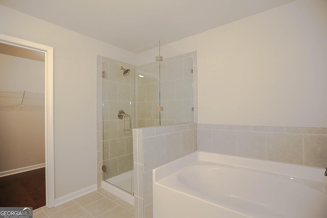 2304 Shetley Creek Dr, Norcross, GA 30071 - full bath with a bath, a stall shower, a spacious closet, and tile patterned flooring