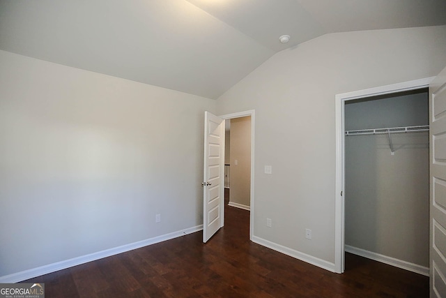 2304 Shetley Creek Dr, Norcross, GA 30071 - unfurnished bedroom featuring lofted ceiling, wood finished floors, a closet, and baseboards